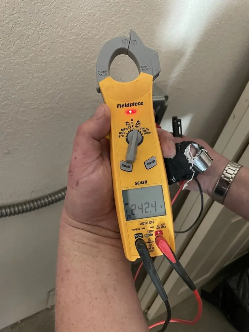 Voltage testing with clamp meter during Electrical Installation Services in Jenks